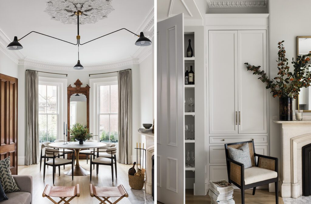 Elegant interior spaces showcasing a dining area with a sculptural round table, modern chairs, and an antique mirror set within a bay window, complemented by a decorative ceiling medallion and contemporary lighting. Adjacent is a custom storage area with sleek white cabinetry, built-in shelving for barware, and a cozy corner featuring a cane accent chair and a marble fireplace adorned with seasonal decor.