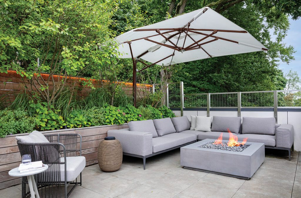 Stylish outdoor entertaining area with comfortable seating, natural elements, and a peaceful ambiance for relaxation.