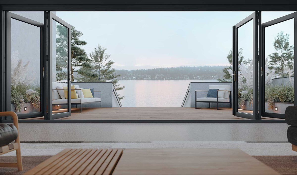 Contemporary living space featuring Marvin bi-fold doors that open to a scenic waterfront deck with outdoor seating.