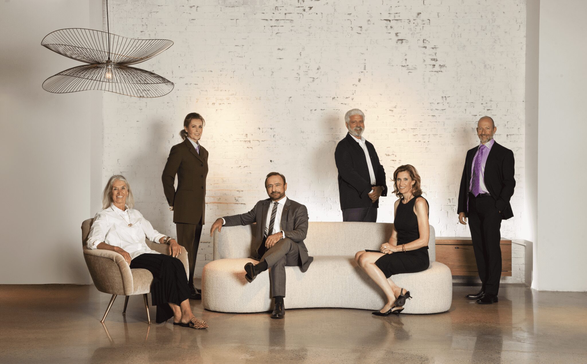 2021_HOF_Inductees_ An image showing the six 2021 New England Design Hall of Fame inductees sitting and standing