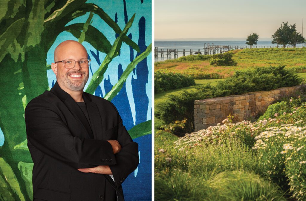 Designer Thomas J. Fraley poses confidently in front of his botanical-inspired rug design, where vivid green leaves and deep blue shadows create a dynamic and artistic backdrop.
